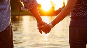 couple holding hands together